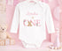Children's clothing with the first birthday pyjamas design