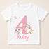 A white t-shirt with a pink number 4 and a unicorn graphic, along with the text "Ruby" below the number.