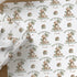 Personalised teddy bear 1st birthday wrapping paper for son featuring custom name, green balloons and first birthday design.