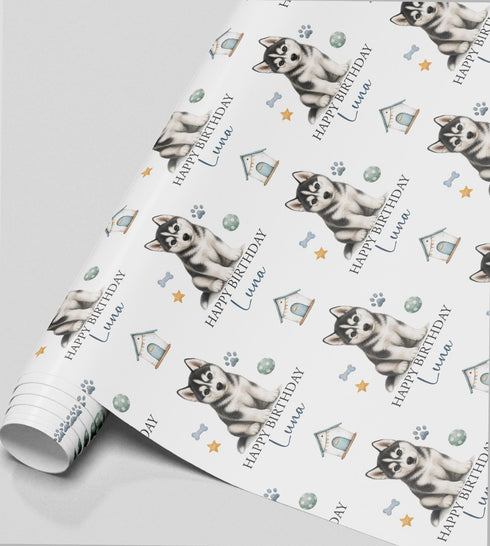 Personalised Husky birthday wrapping paper featuring a cute Siberian Husky puppy, custom name and birthday message with paw prints and dog toys.