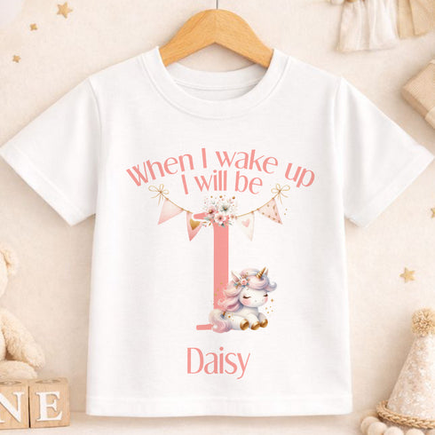 A white t-shirt with a personalized message and a unicorn graphic printed on it.
