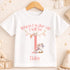 A white t-shirt with a personalized message and a unicorn graphic printed on it.