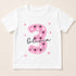 A white t-shirt with a pink number 3 and paw prints design, along with the name "Olivia" written below it.