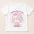 A white t-shirt with a cartoon unicorn and a birthday message printed on it.