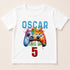 A white t-shirt with a colorful graphic design featuring a video game controller and the text "OSCAR LEVEL UP 5" printed on it.
