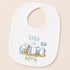 A white baby bib with a design featuring a rabbit and balloons, along with the text "Today I am one Rory".