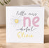The image is a personalized birthday card for a little girl named Olivia, featuring a flower and the text "little miss one derful Olivia".