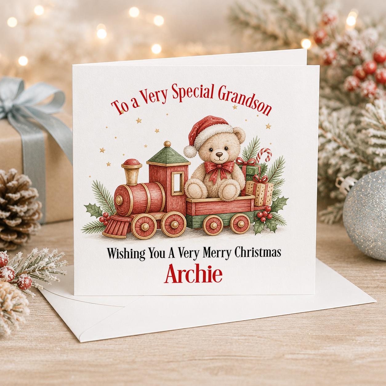 Personalised Christmas card, white 6x6 inch square card printed with teddy bears on a red toy train full of presents with a name