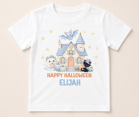 Personalised Halloween t-shirt featuring haunted house, ghost, black cat, bat, pumpkins and custom name on white children's Halloween shirt