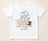 Personalised Halloween t-shirt featuring haunted house, ghost, black cat, bat, pumpkins and custom name on white children's Halloween shirt