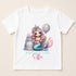 A white t-shirt with a graphic design featuring a mermaid character and a birthday cake.