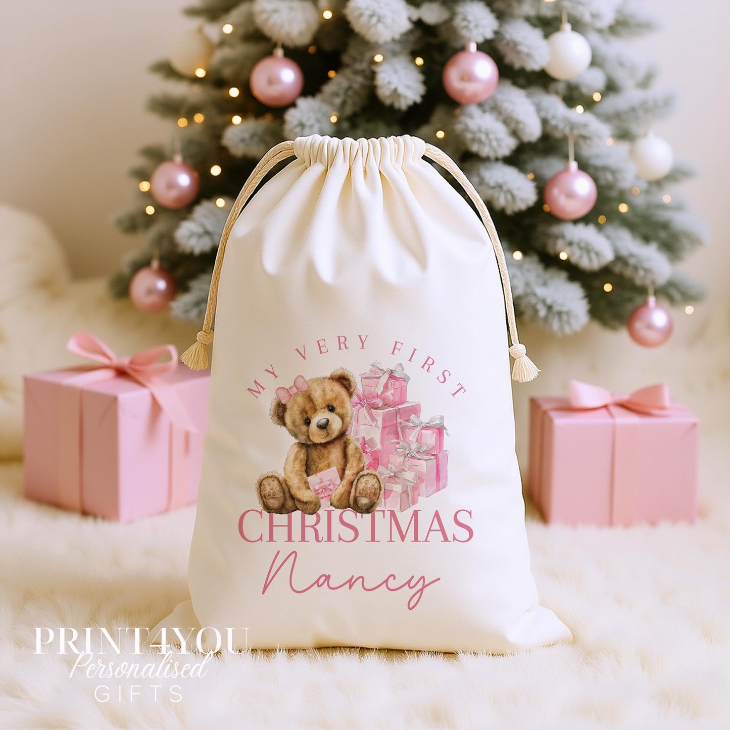 Personalised my first Christmas sack, cream cotton drawstring santa sack printed with a teddy bear and pink presents and My Baby First Christmas with a name