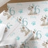 a pattern of wrapping paper with a cartoon dog and the number 6. The wrapping paper has the text "Harley" and "FOR ASPICULT NEPHEW Harley" printed on it.