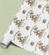 a repeating pattern of teddy bears and balloons on a white background, along with the text "Happy First Birthday" and "To a Wonderful Son" printed on the wrapping paper.