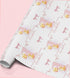 a roll of wrapping paper with a repeating pattern of a yellow duck holding balloons and the name "Abella" written on it.