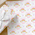 Personalised rainbow birthday wrapping paper featuring rainbow and cloud design, custom name and age, pastel stars and birthday gift wrap for girls.