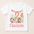A white t-shirt with a cartoon image of farm animals, including a horse, cow, pig, and sheep, along with a number 2 and the name "Charlotte" printed on it.