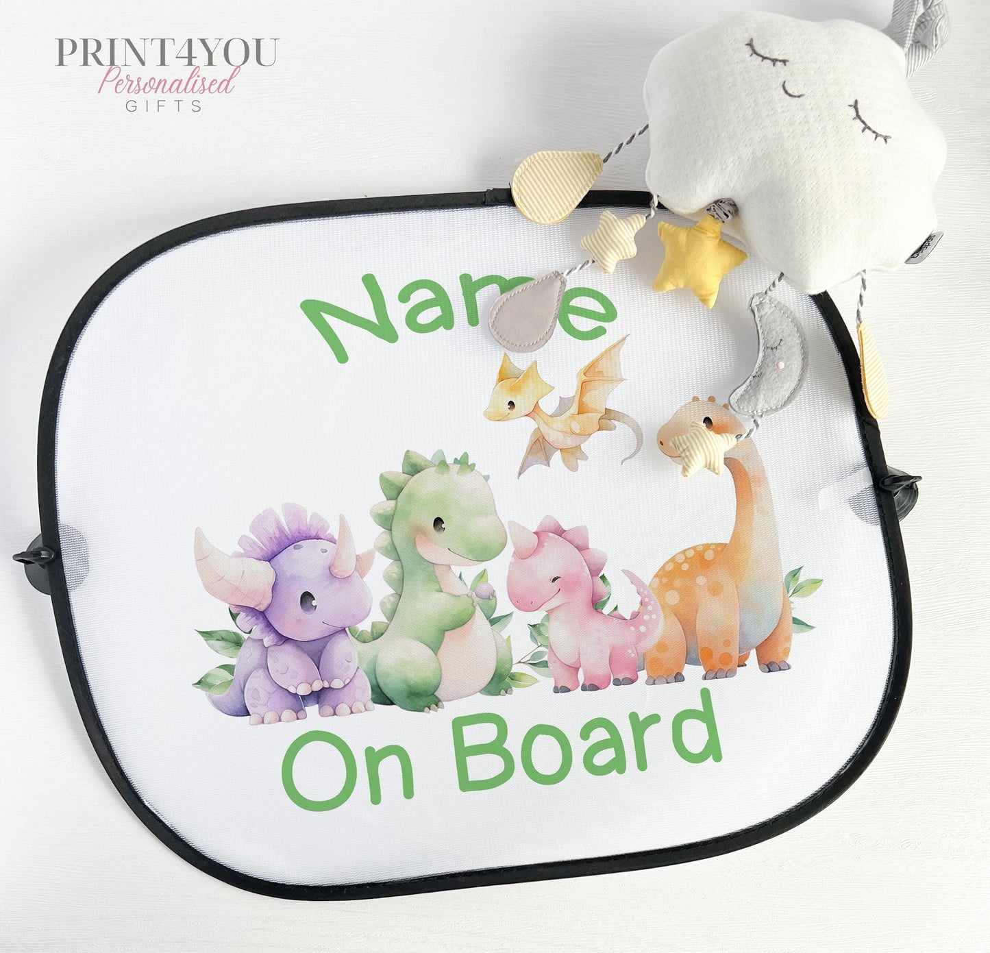 Personalised car window sun shade with a white netted surface, printed with a cute dinosaur design and suction cups for attachment