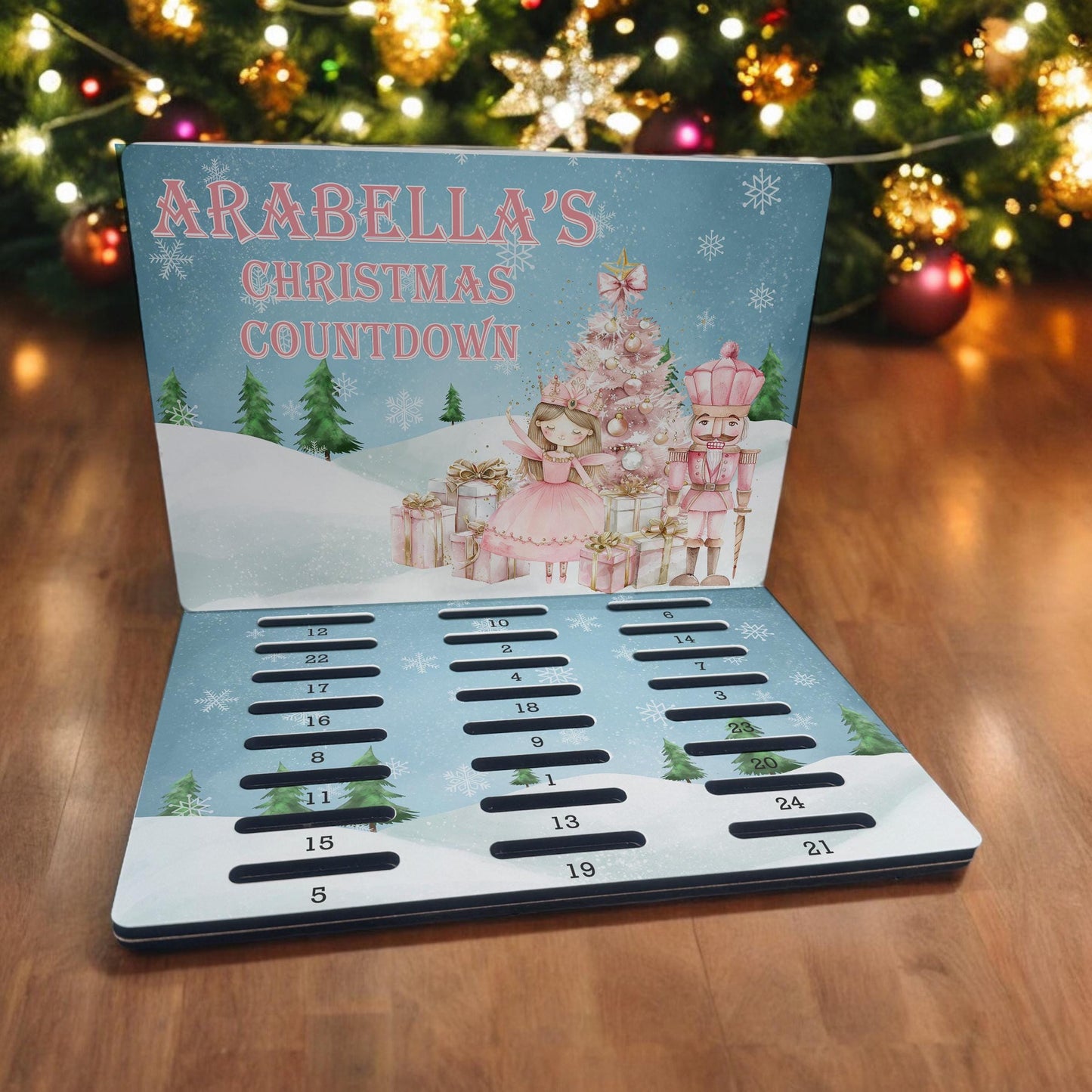 Personalised A5 MDF advent calendar countdown board featuring a pink nutcracker design with a custom name printed across the front