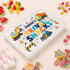 Personalised children’s travel snack box with colourful diggers and construction vehicles