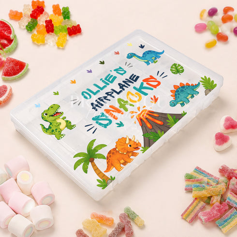 Personalised children’s travel snack box with colourful dinosaurs and prehistoric scenery