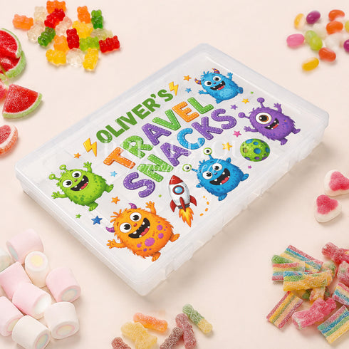 Personalised children’s travel snack box featuring colourful friendly monsters and a rocket