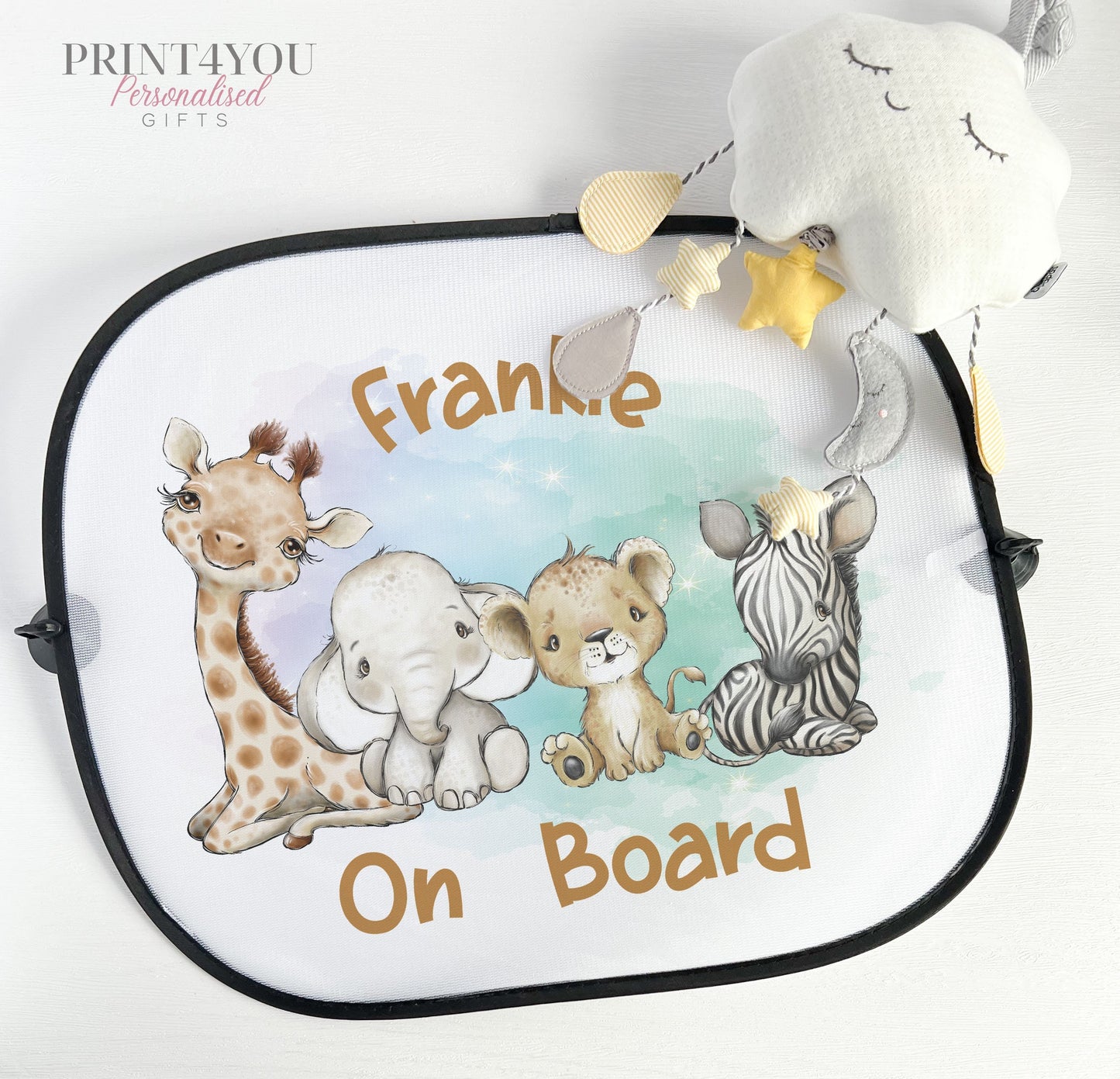 Pair of white netted car window sun shades printed with safari jungle animal designs, attached with suction cups.