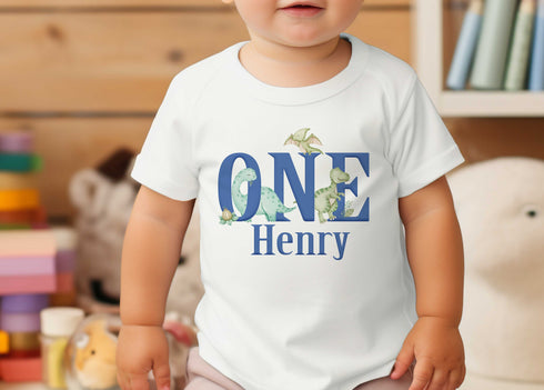 Cute Dinosaur Personalised 1st Birthday T-Shirt - Customised Cotton White Top with Number ONE Print Blue Font