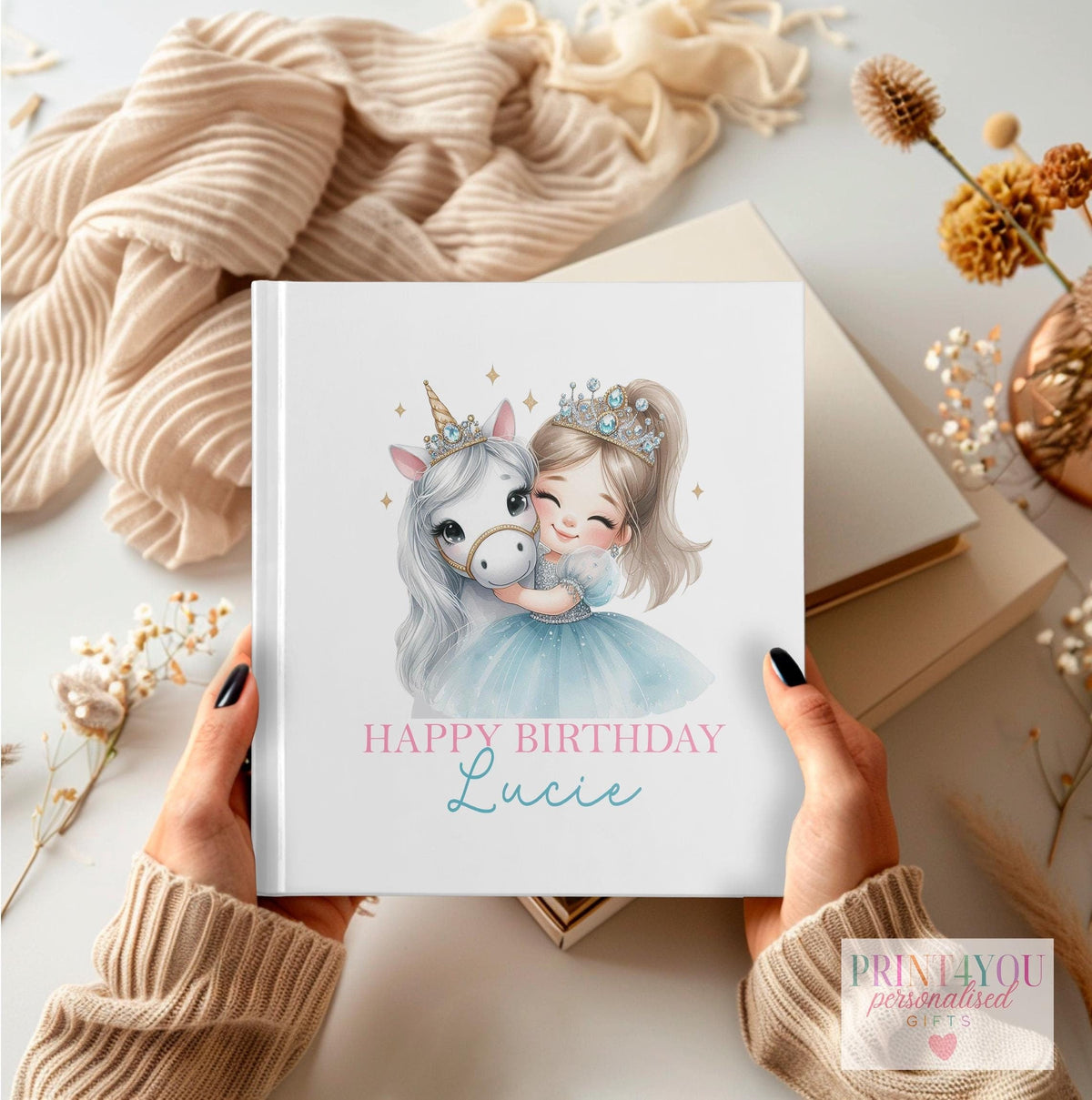 Personalised first birthday photo album with princess and unicorn design and custom name on the cover