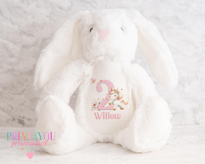 Pink personalised first birthday bunny soft toy with unicorn design printed on tummy