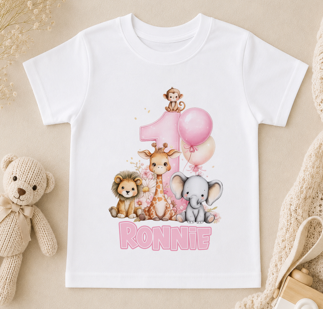 White T-shirt printed with giraffe, lion and elephant illustrations, a pink balloon and the sample name 'Ronnie'