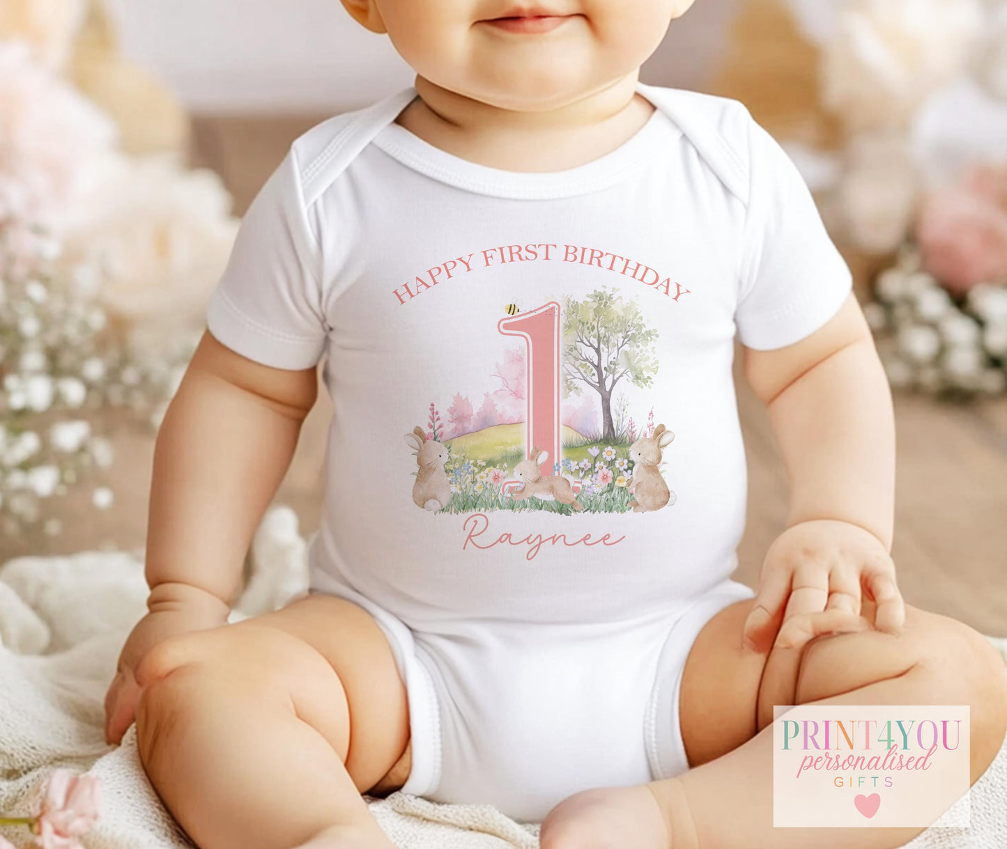 Personalised bunny rabbit first birthday t-shirt with baby's name printed on the front.