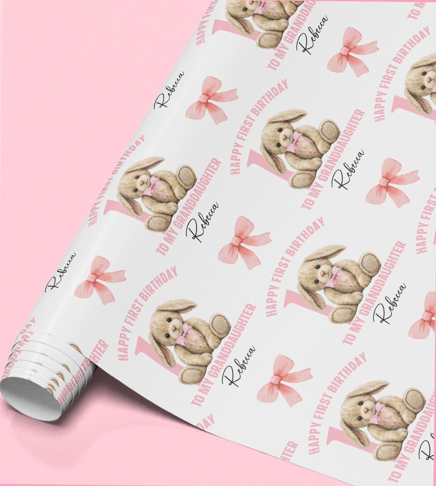 Roll of personalised pink rabbit wrapping paper with a bow design, printed with a custom name and relation