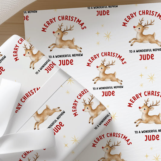 Personalised Christmas wrapping paper featuring a cute reindeer with a red nose, custom name and relation, festive Christmas gift wrap.