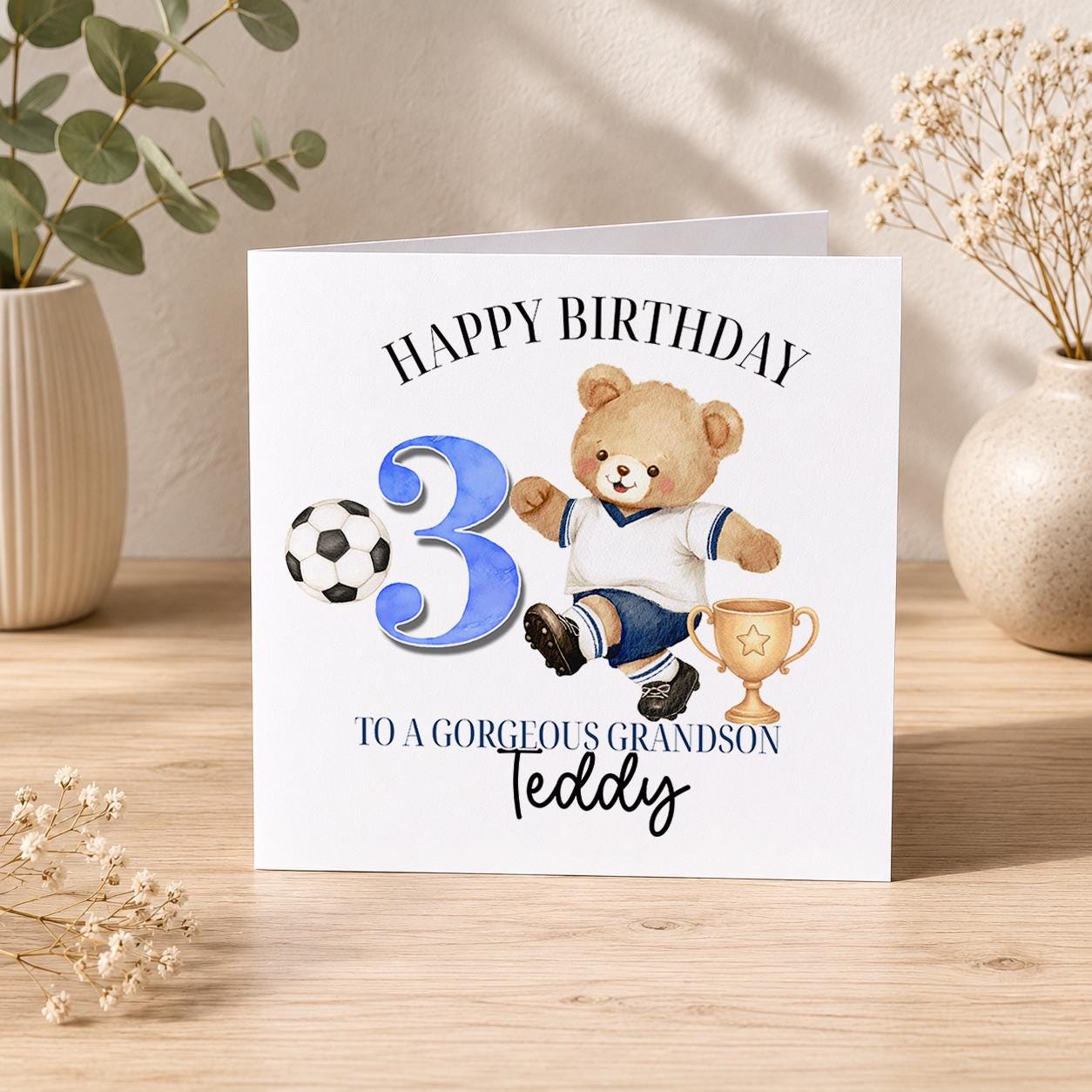 Square personalised football birthday card featuring a teddy bear celebrating a goal, for a boy's birthday.
