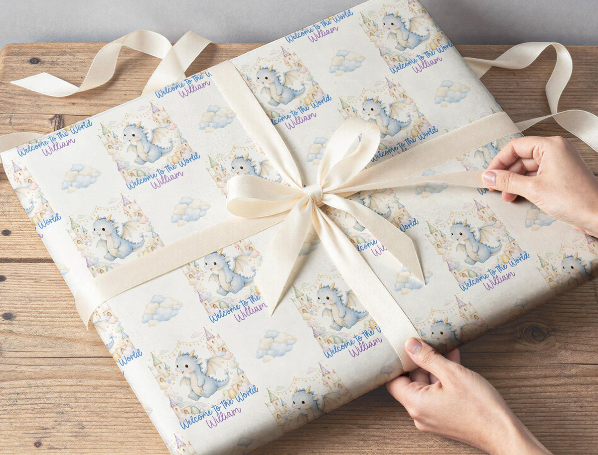 Personalised baby boy wrapping paper sheet laid flat showing the full blue dragon repeat pattern
