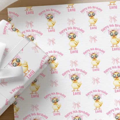 Roll of personalised duck birthday wrapping paper printed with a name and age