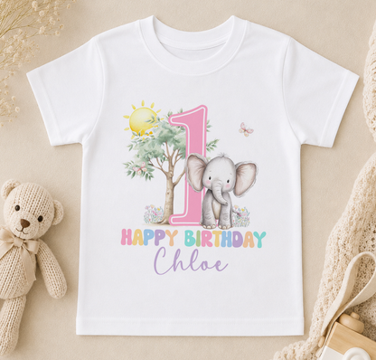A white t-shirt with a pink number one and an elephant, along with the text "Happy Birthday Chloe" printed on it.
