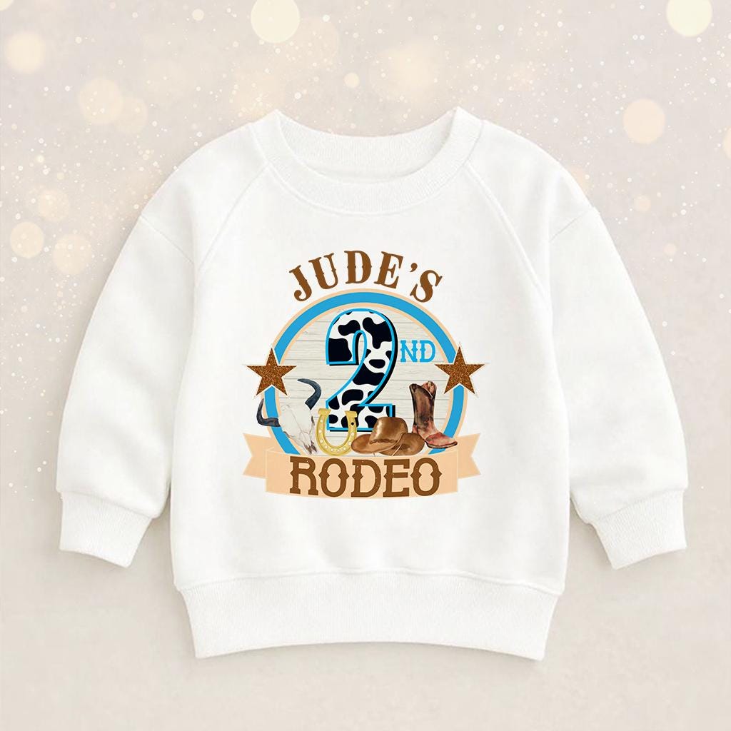 Close-up of the rodeo cowboy print and personalised name on the children's birthday shirt