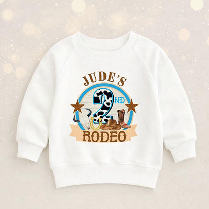 Close-up of the rodeo cowboy print and personalised name on the children's birthday shirt