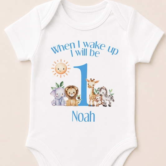 Personalised blue safari first birthday vest with baby's name and 'When I Wake Up I Will Be One' print.