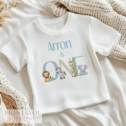 Personalised safari animal 1st birthday bib, printed with baby's name and a lion, zebra and giraffe design.
