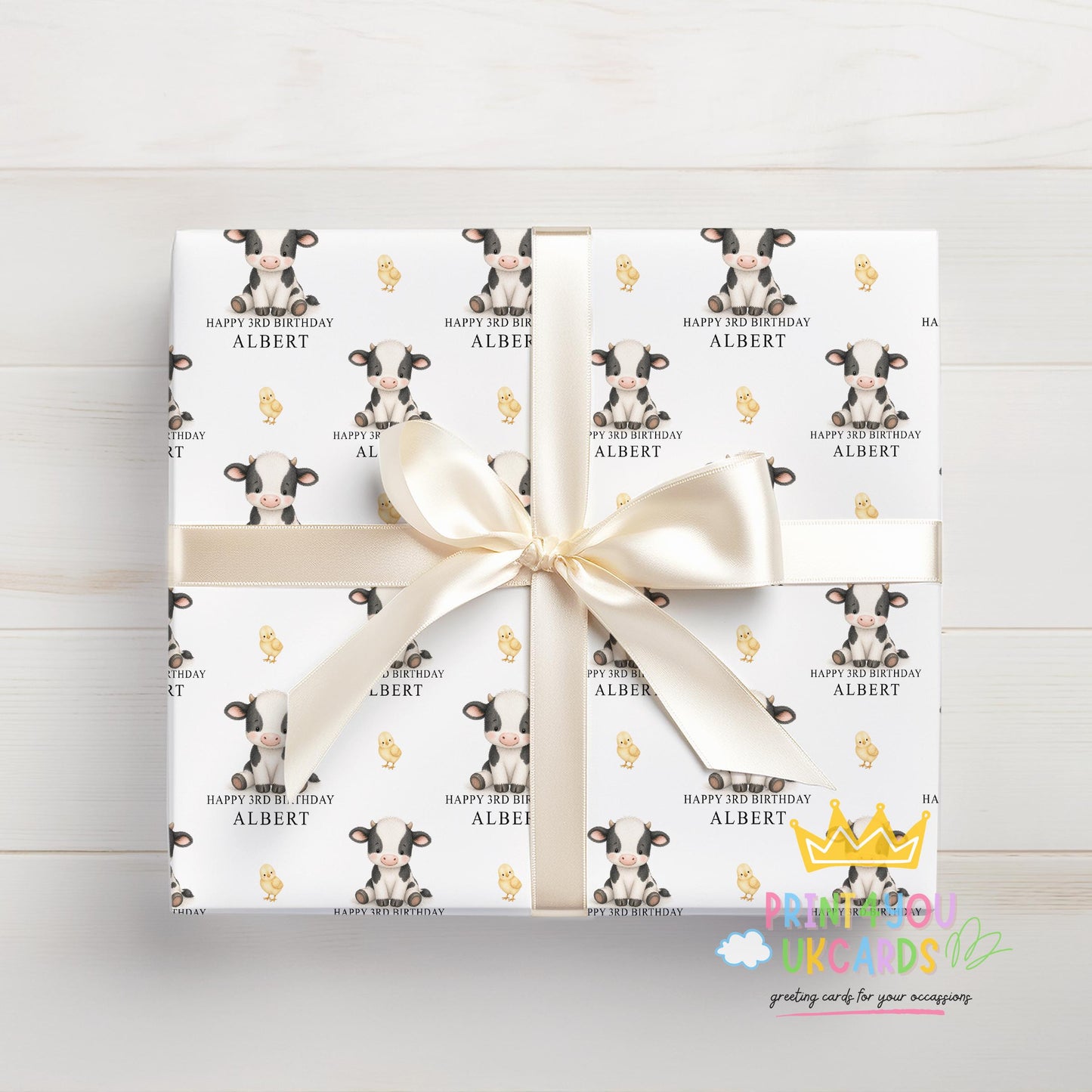 Section of the personalised cow wrapping paper showing the cow print and personalisation