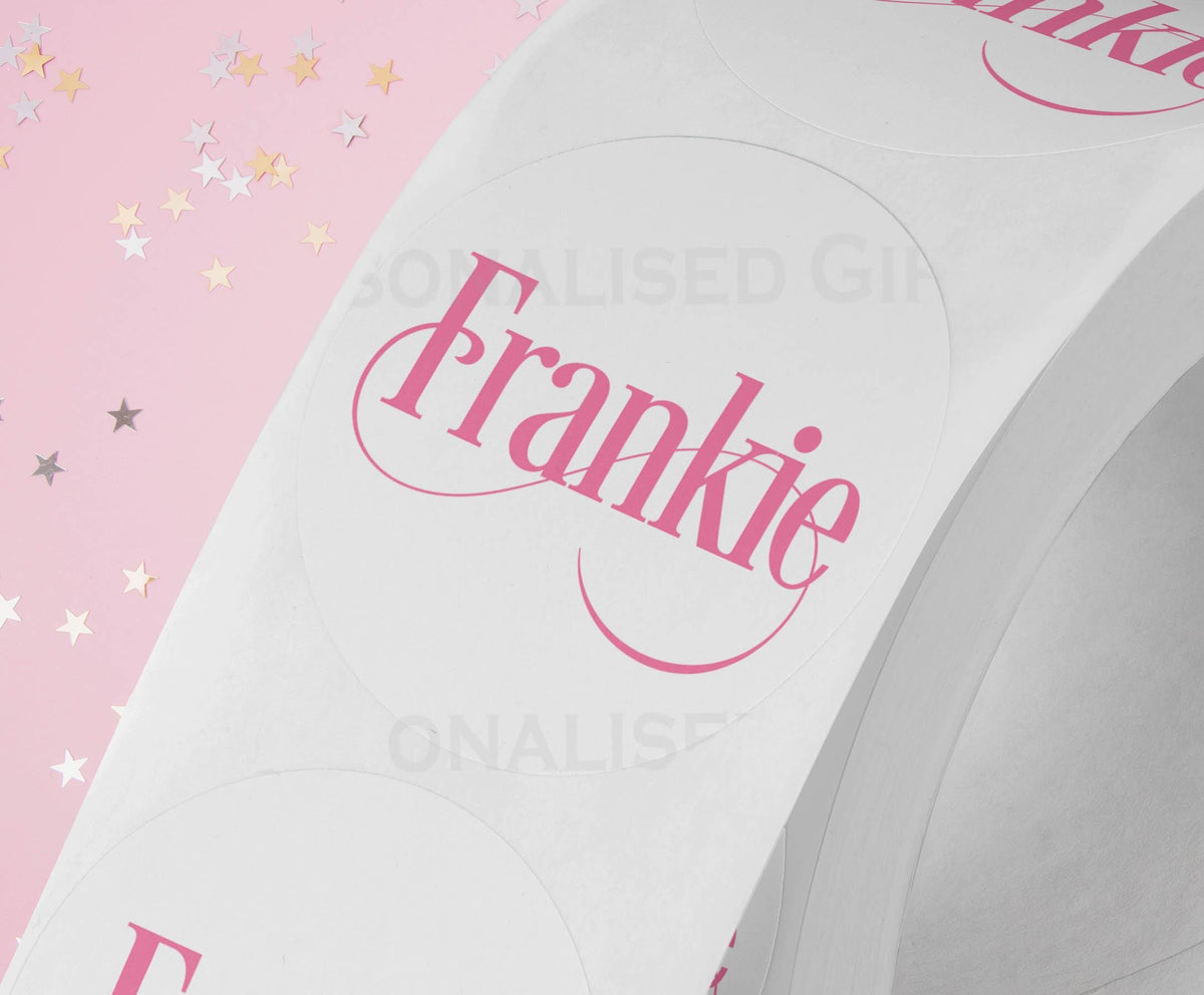 Personalised colourful festive name sticker size comparison for scale