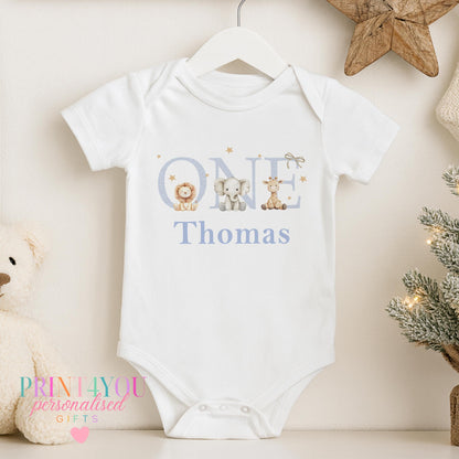 Personalised jungle safari sleepsuit with a custom name and giraffe, elephant and lion design.