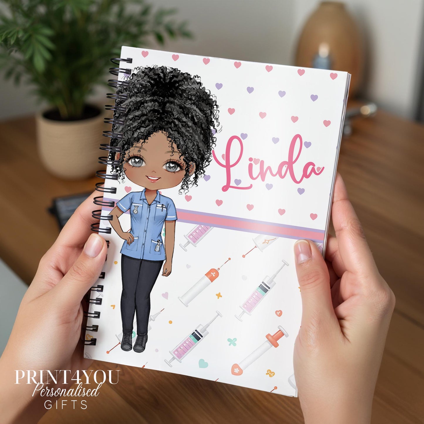 Personalised A5 nurse notebook with spiral binding, printed with a custom name and Nurse 4 character design