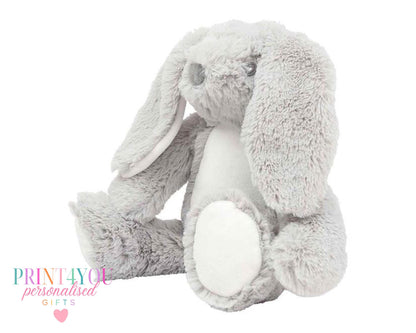 Personalised bunny book cushion styled on a child's bed