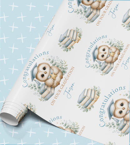 Personalised graduation wrapping paper roll with owl in a mortar board, books and the name Jessa
