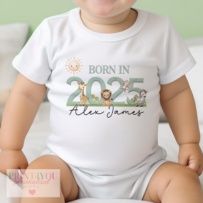 Personalised safari baby bib with lion, elephant and giraffe print and custom name, 100% cotton.