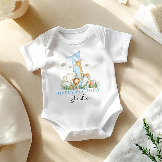 Personalised blue safari 1st birthday t-shirt, printed with baby's name and the lion and giraffe design.